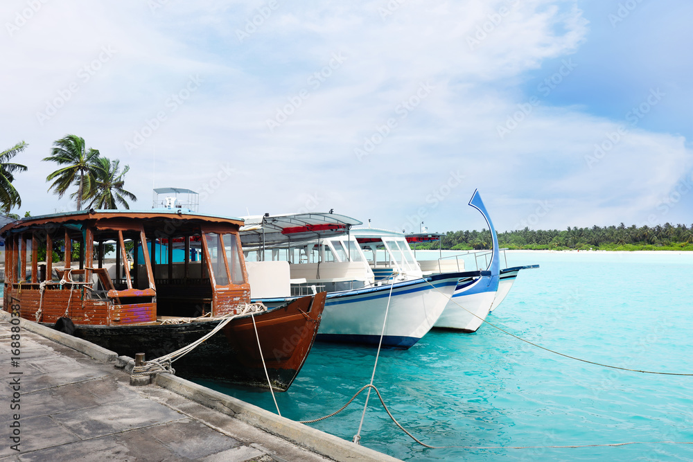 Boats berthed at tropical resort