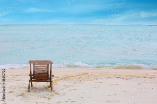 Beach chair on sea shore at resort © Africa Studio