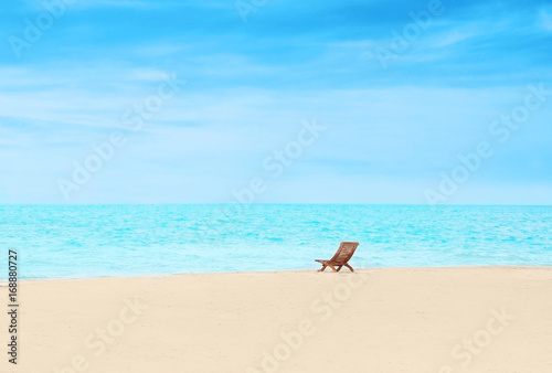 Beach chair on sea shore at resort © Africa Studio