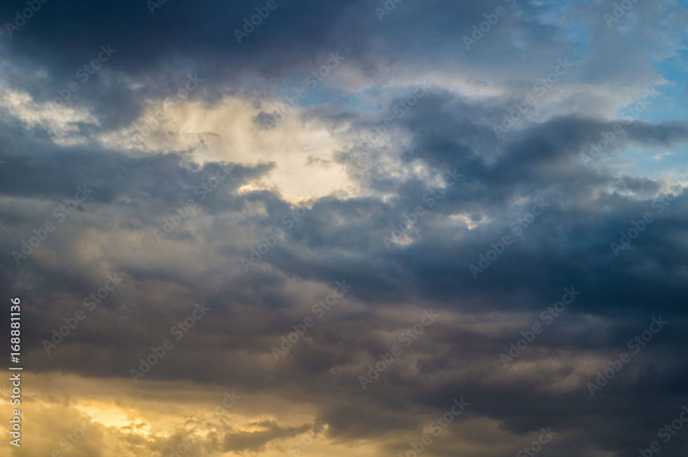 dark clouds in bad weather with sunset