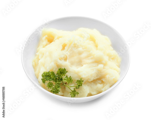 Bowl with mashed potatoes on white background