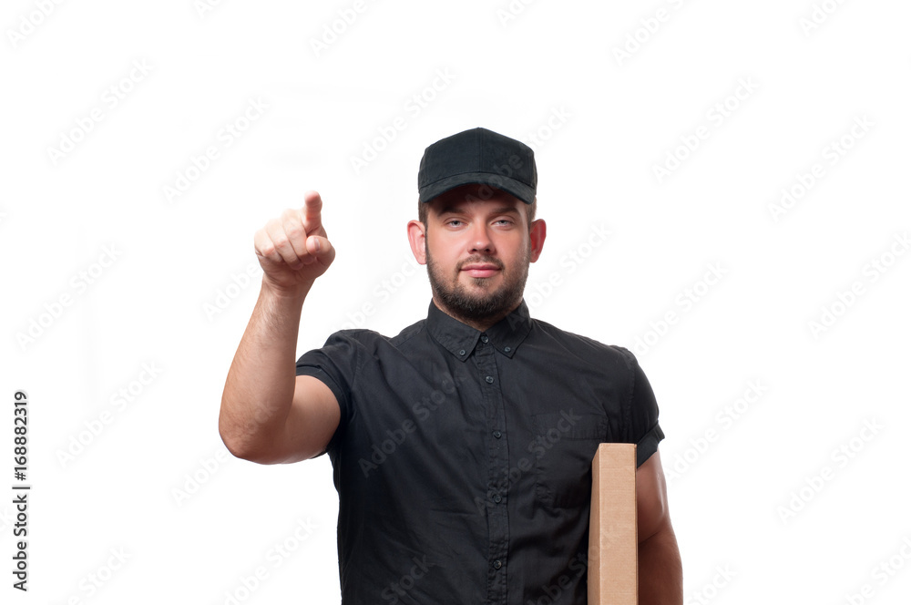 Delivery man with cardboard box is ringing the door bell