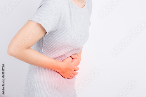 asian woman having stomachache photo