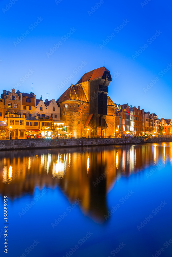 Obraz premium Gdansk at night with reflection in Motlawa river, Poland