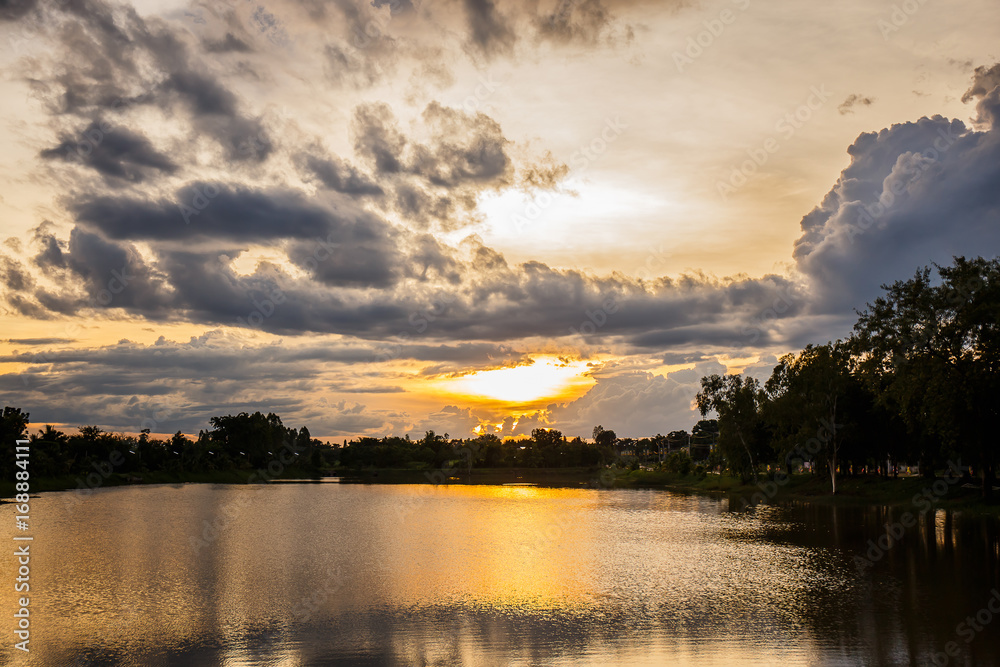 Landscape sunset  over lake in park.