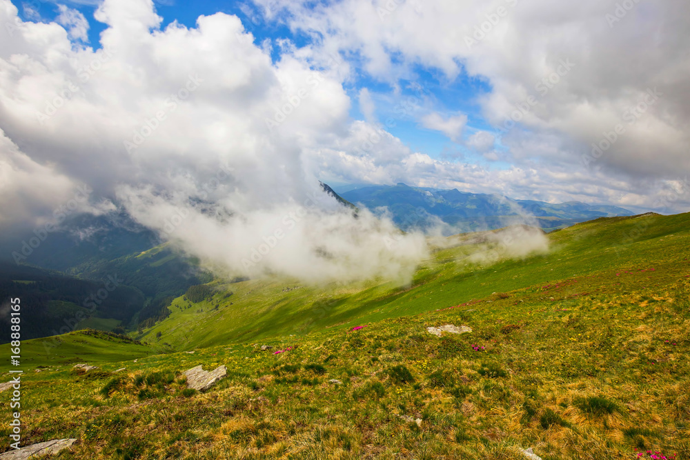 Mountain valley with clouds touching the hill , beautiful scenic summer landscape Mountain valley with clouds touching the hill , beautiful scenic summer landscape