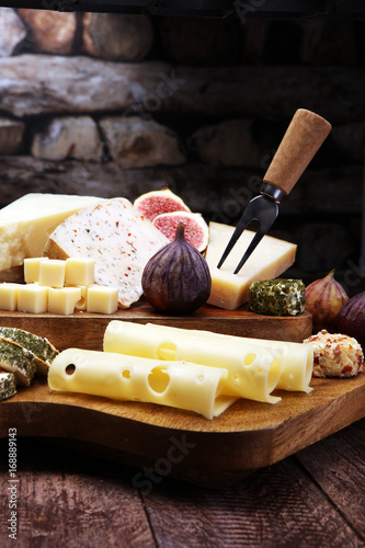 Cheese plate served with figs, various cheese on a platter