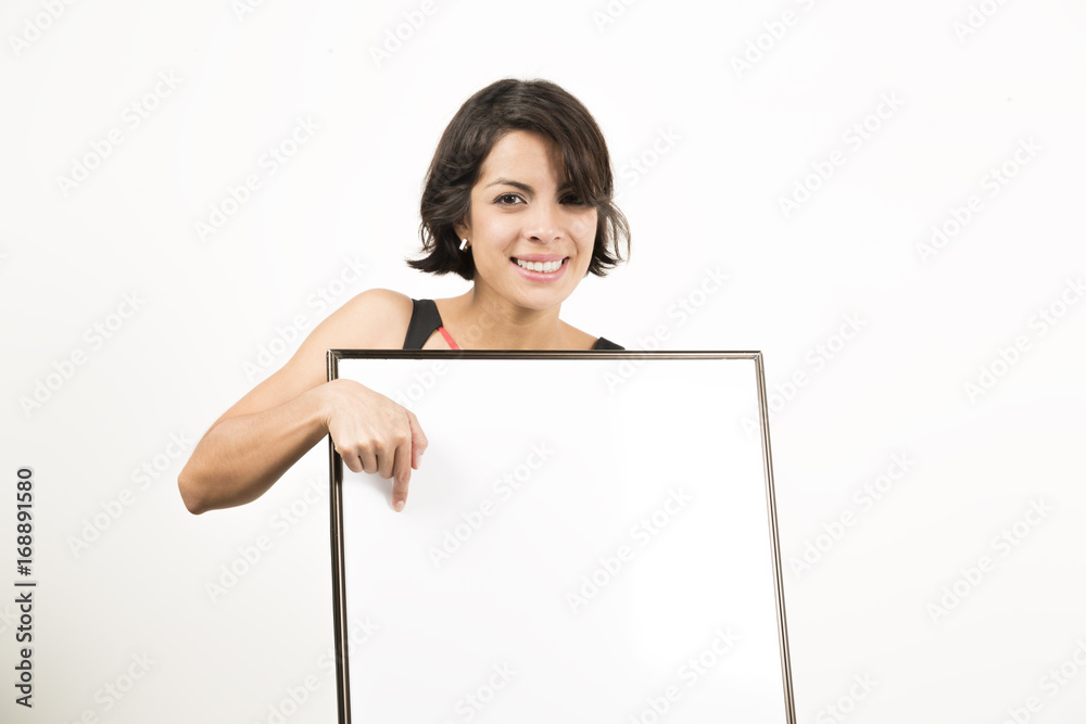 Beautiful young woman holding a blank sheet of paper Beautiful young woman holding a blank sheet of paper