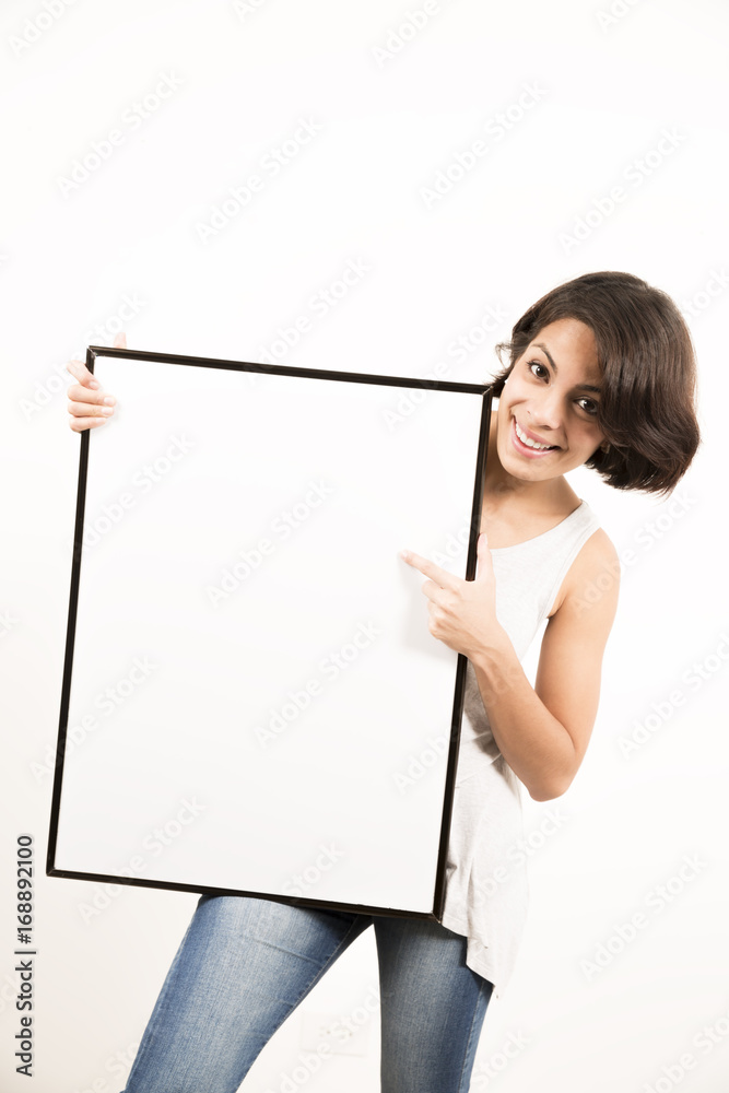 Beautiful young woman holding a blank sheet of paper Beautiful young woman holding a blank sheet of paper