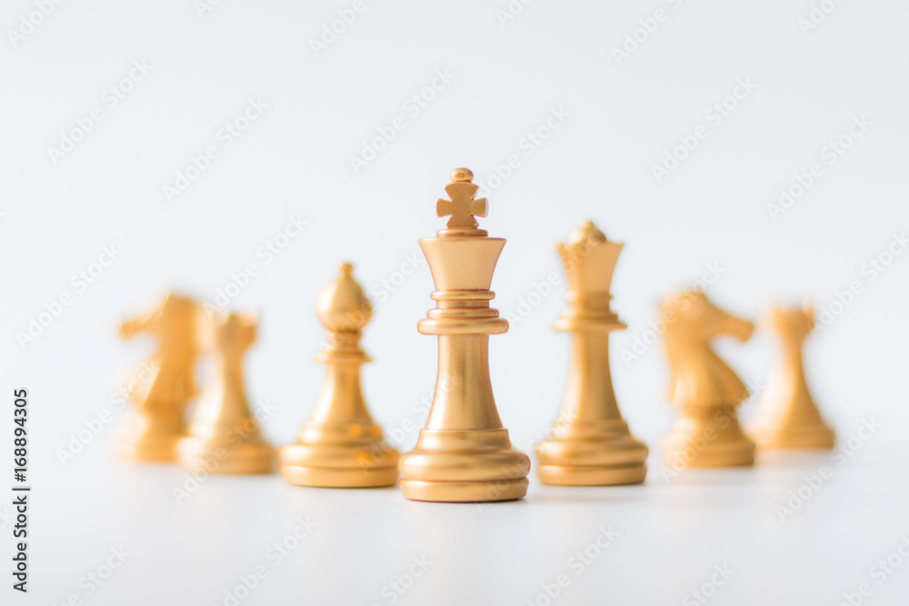 Gold Chess on chess board game for business metaphor leadership concept select focus on king chess shallow depth of field Gold Chess on chess board game for business metaphor leadership concept select focus on king chess shallow depth of field