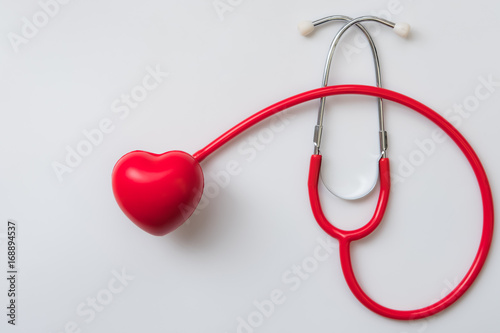 close up red heart and stethoscope on white background, world health day concept, process vintage tone