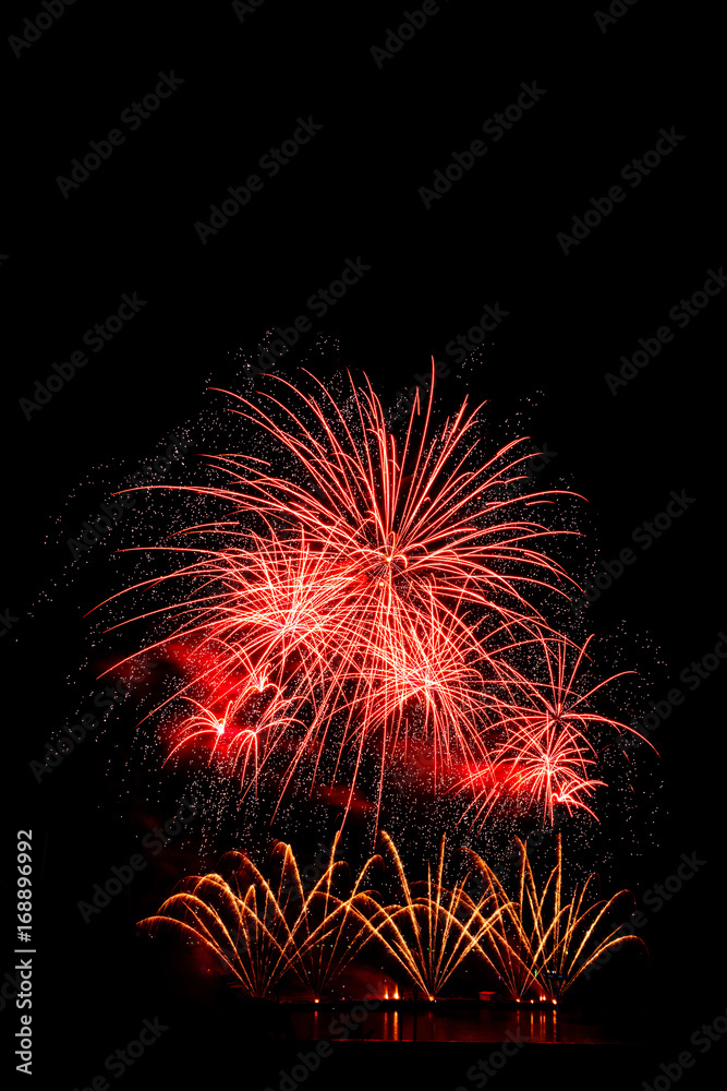 beautiful red fireworks display for celebration happy new year and merry christmas on black isolated background
