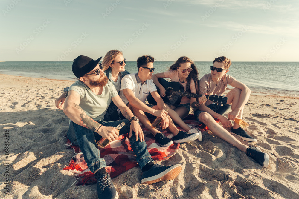 Fototapeta premium group of friends having fun on the beach