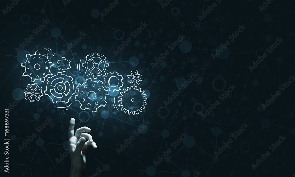 Glowing cogwheel mechanism icon on dark background as symbol of teamwork Glowing cogwheel mechanism icon on dark background as symbol of teamwork