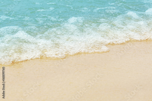 Soft wave of blue ocean on sandy beach. Background. © Iana Alter