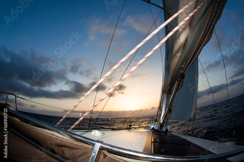 Sail boat gliding in open sea at sunset © frantisek hojdysz