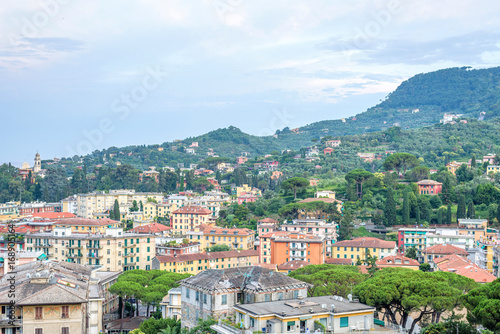 Beautiful evening sunset view from top to Santa Margherita Ligure city. Blue sky and colorful buildings. Italy beauties.