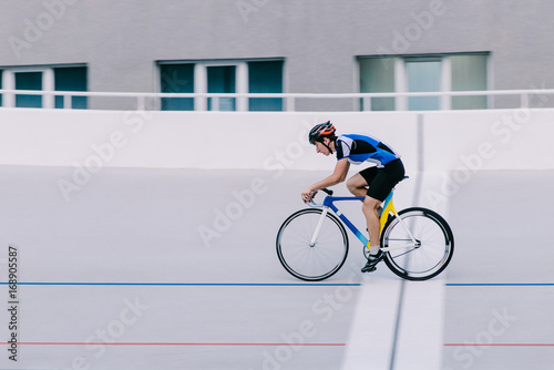 A cyclist rides a bike on a cycle track.