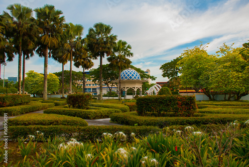 Pavilion and trees with bushes. Miri City Fan Park, Borneo, Sarawak, Malaysia photo