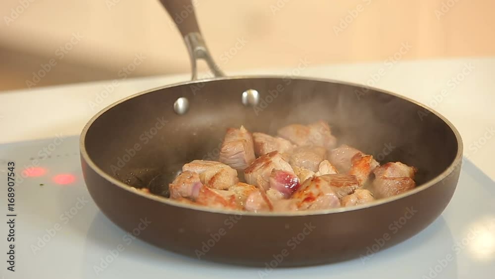 Frying pork cubes on teflon frying pan Frying pork cubes on teflon frying pan