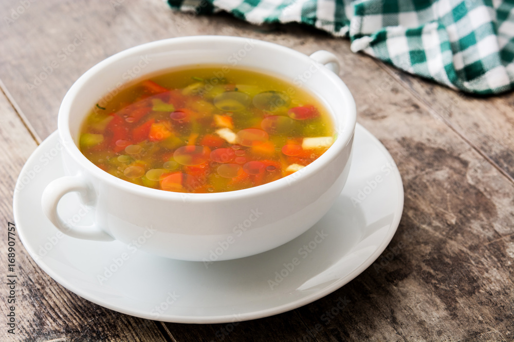 Vegetable soup in bowl on wooden table
Vegetable soup in bowl on wooden table