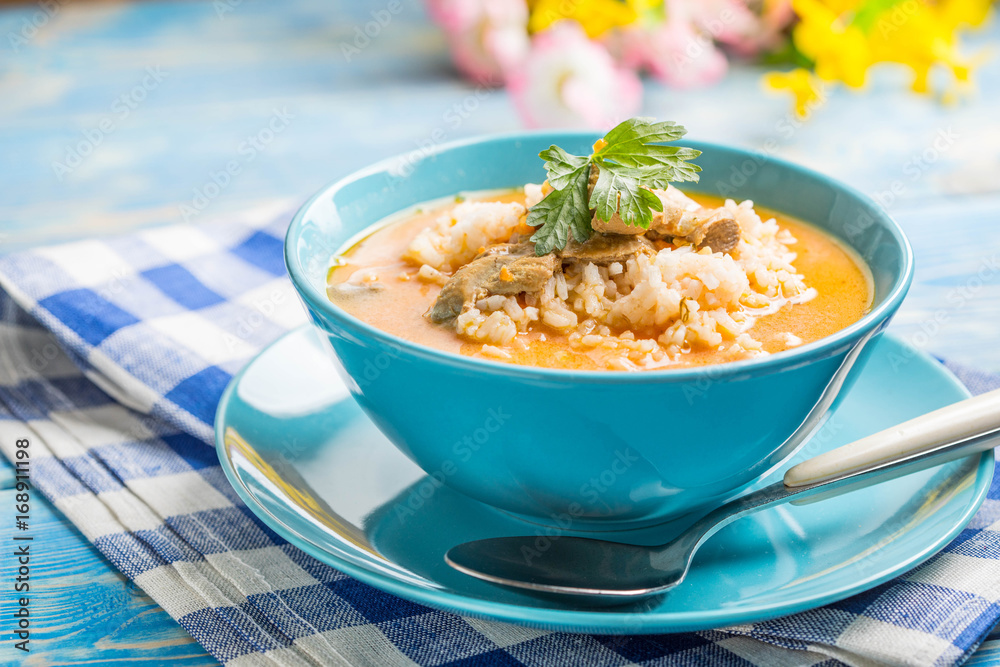 Tomato soup with rice.