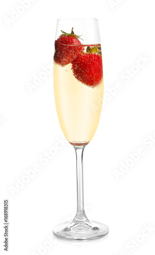 Glass of delicious wine with strawberry on white background