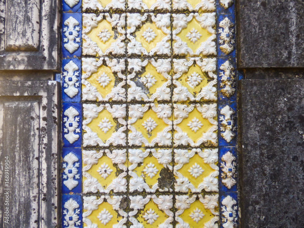 White, yellow and blue traditional portuguese tiles (azulejos) with relief