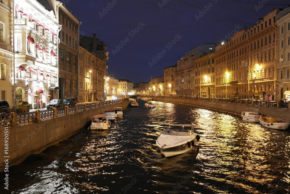 watercourse of St. Petersburg town in the night between buildings