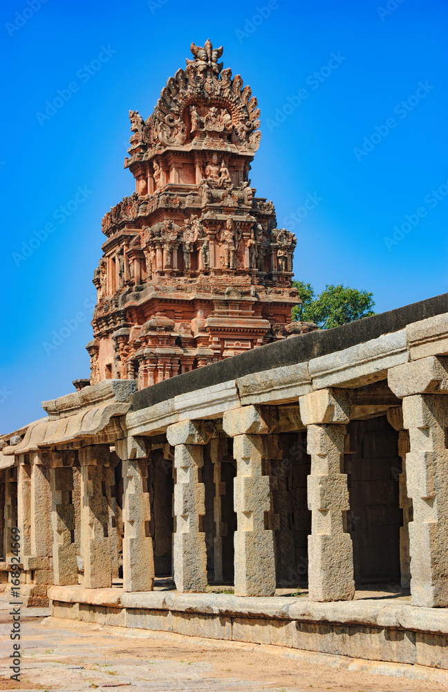 Crumbling stone statues and bas-reliefs at the top of the temple of Bala Krishna in Hampi, Karnataka, India. Famous Indian landmark, World Heritage.