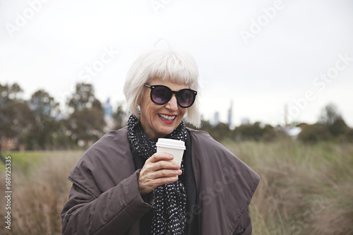 Older stylish lady in the park