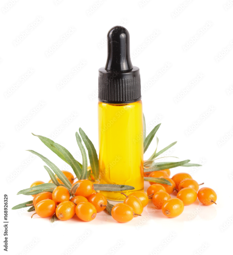 Sea-buckthorn oil with berries and leaves isolated on white background