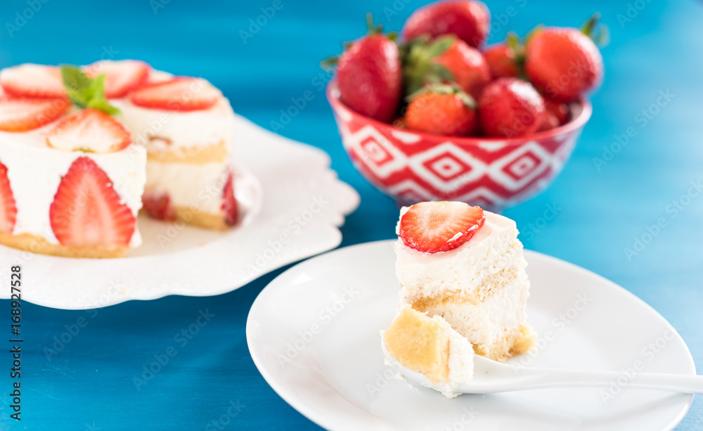Strawberry cake with sour cream on a blue background top view Strawberry cake with sour cream on a blue background top view