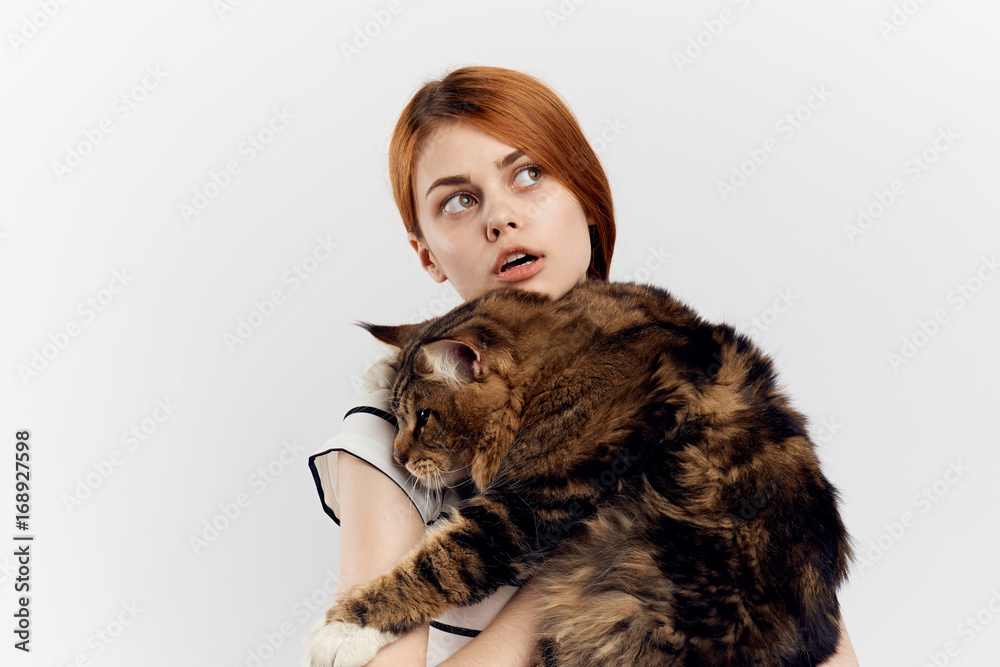 Woman holding a cat, portrait