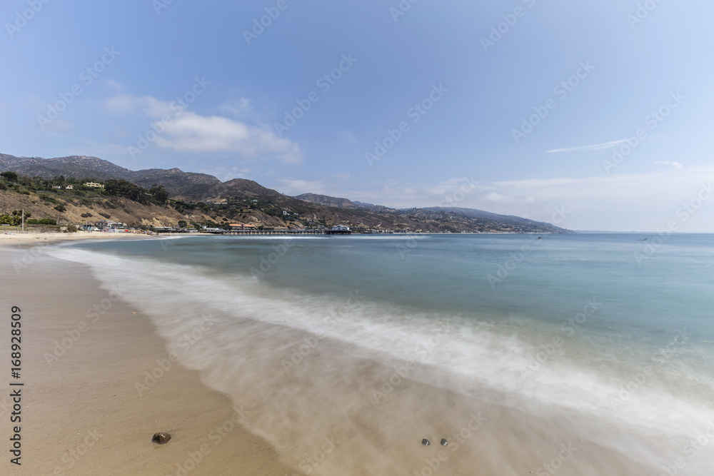 Malibu beach with motion blur surf near Los Angeles in Southern California.  