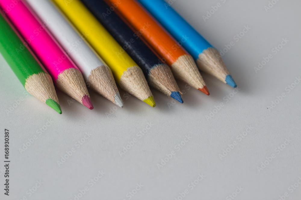 Close-up of a group of multicolored pencils on a white background Close-up of a group of multicolored pencils on a white background