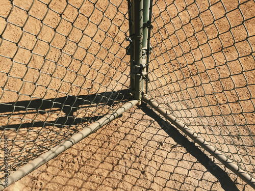 Detail of chain-link and fence and shadows