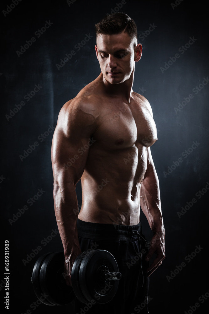Athletic male with dumbbells