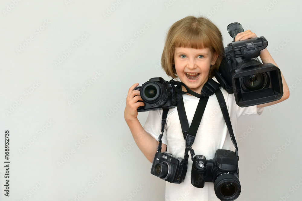 child, kid on white background with space for inscriptions with photography equipment and video camera