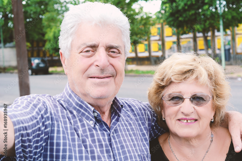 Old couple taking selfie. Old couple taking selfie.