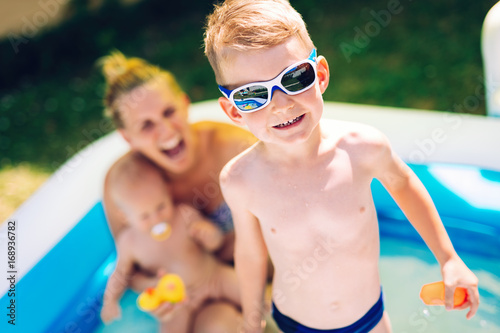 Picture of happy family in swimming pool