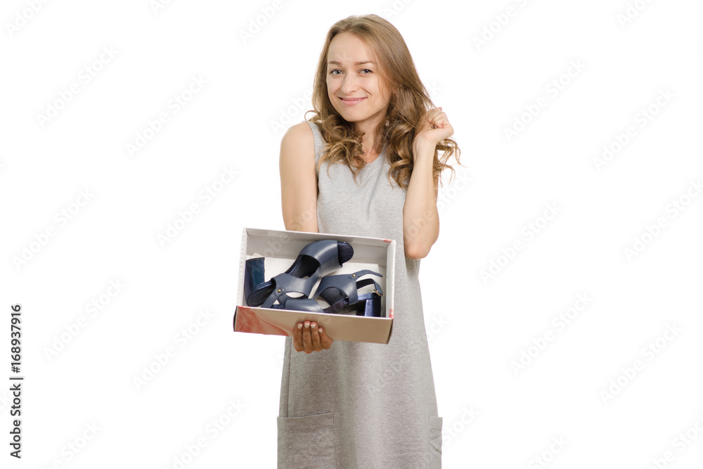 Beautiful young woman with a box of new shoes Beautiful young woman with a box of new shoes
