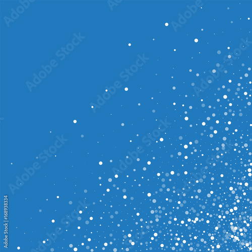 Random falling white dots. Scattered bottom right corner with random falling white dots on blue background. Vector illustration.