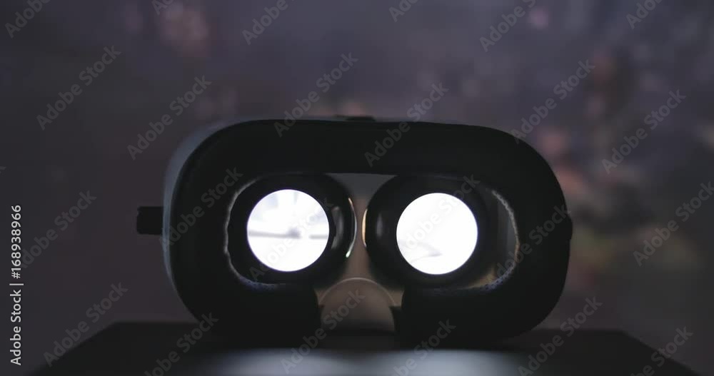 VR device playing movie at night
