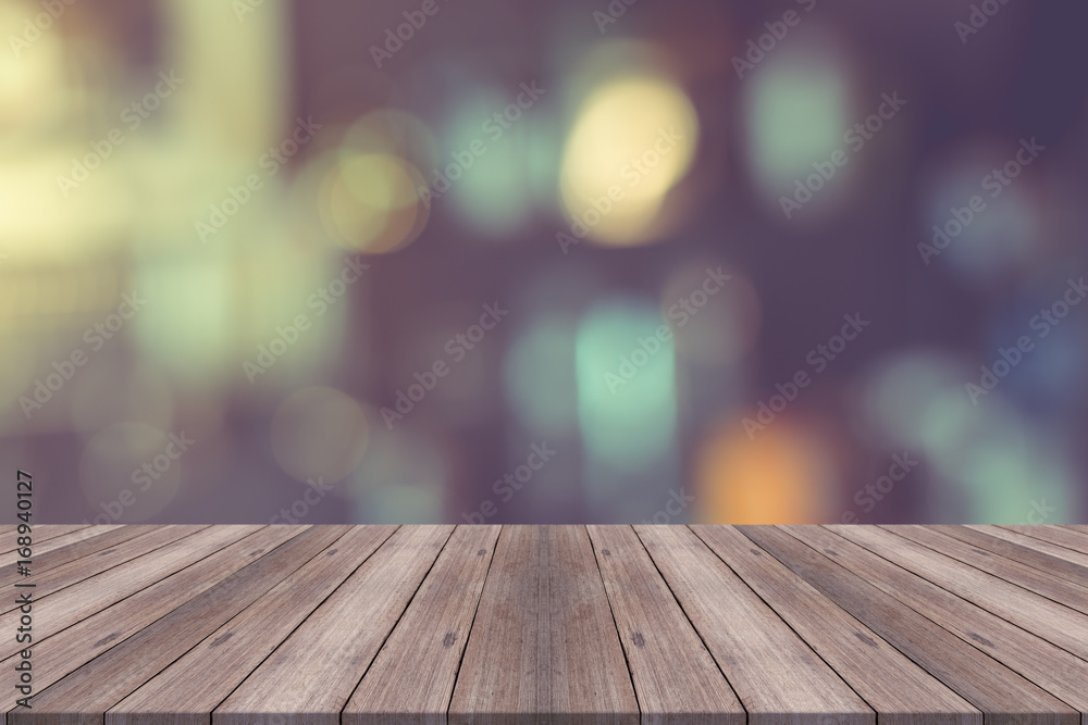 Empty wood table top on blurred background,for montage your products Empty wood table top on blurred background,for montage your products