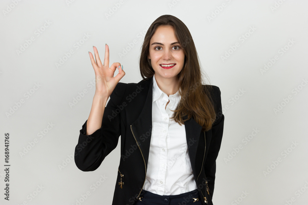 Young businesswoman showing ok sign Young businesswoman showing ok sign