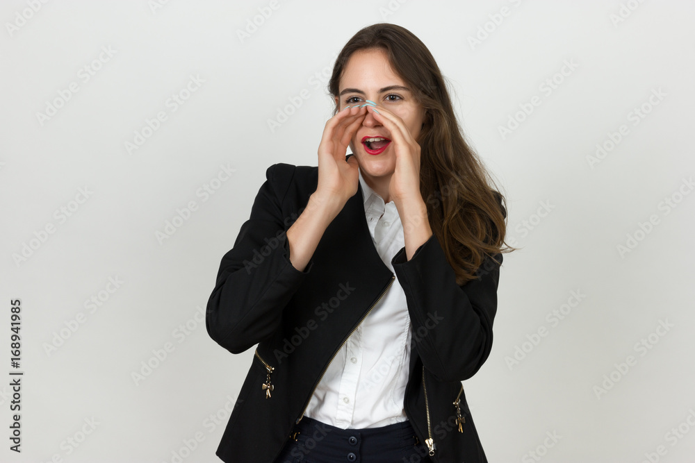 Portrait of a pretty young businesswoman screaming put two hands to her face Portrait of a pretty young businesswoman screaming put two hands to her face