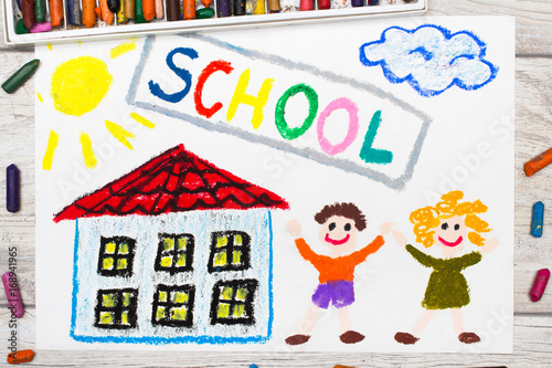 Photo of  colorful drawing  Word SCHOOL  school building and happy children. First day at school.