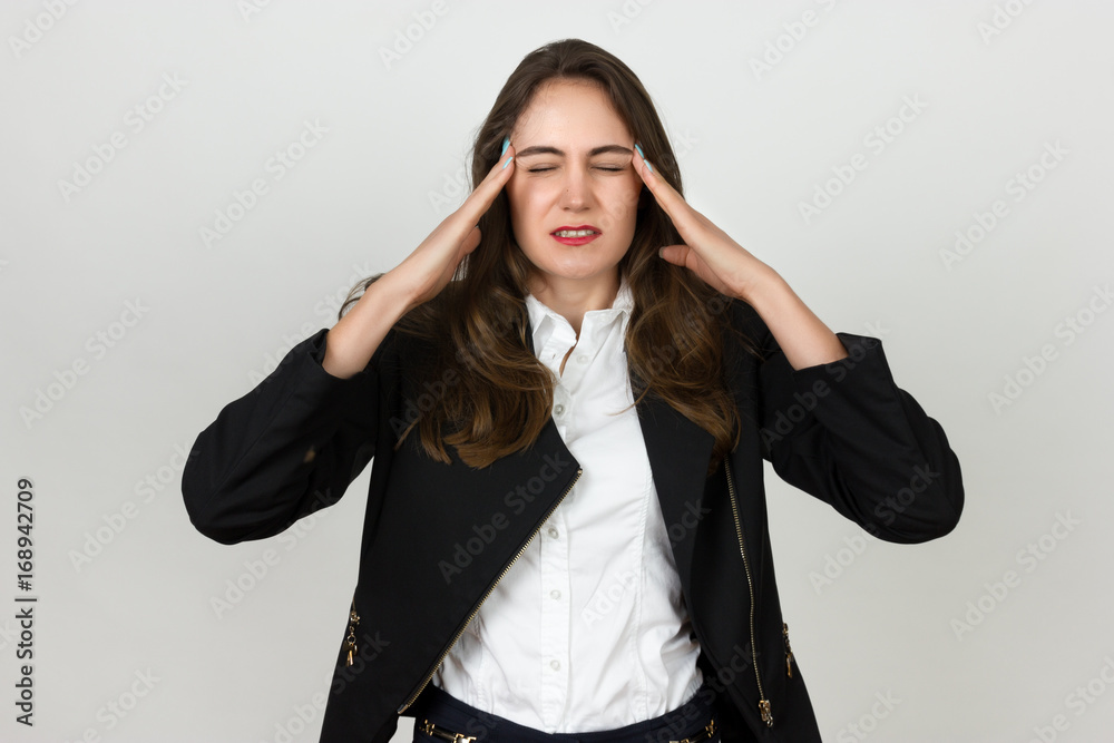 Portrait of a pretty young businesswoman stress and headache having migraine pain