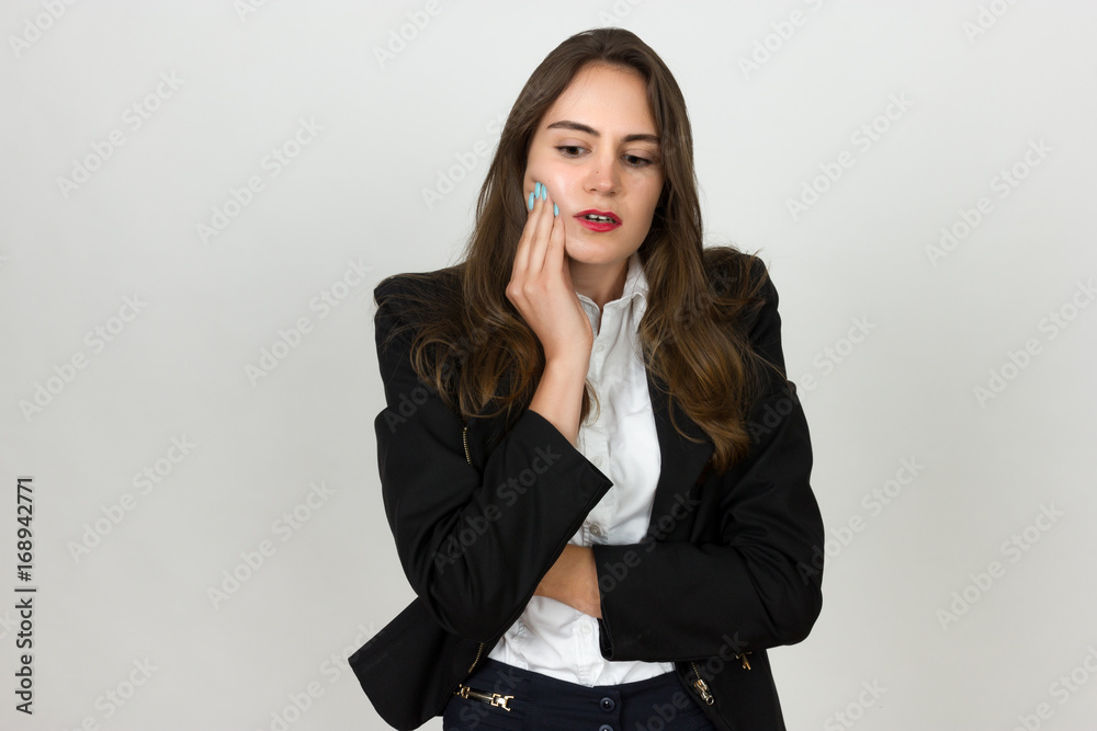 Portrait of a pretty young businesswoman having toothache